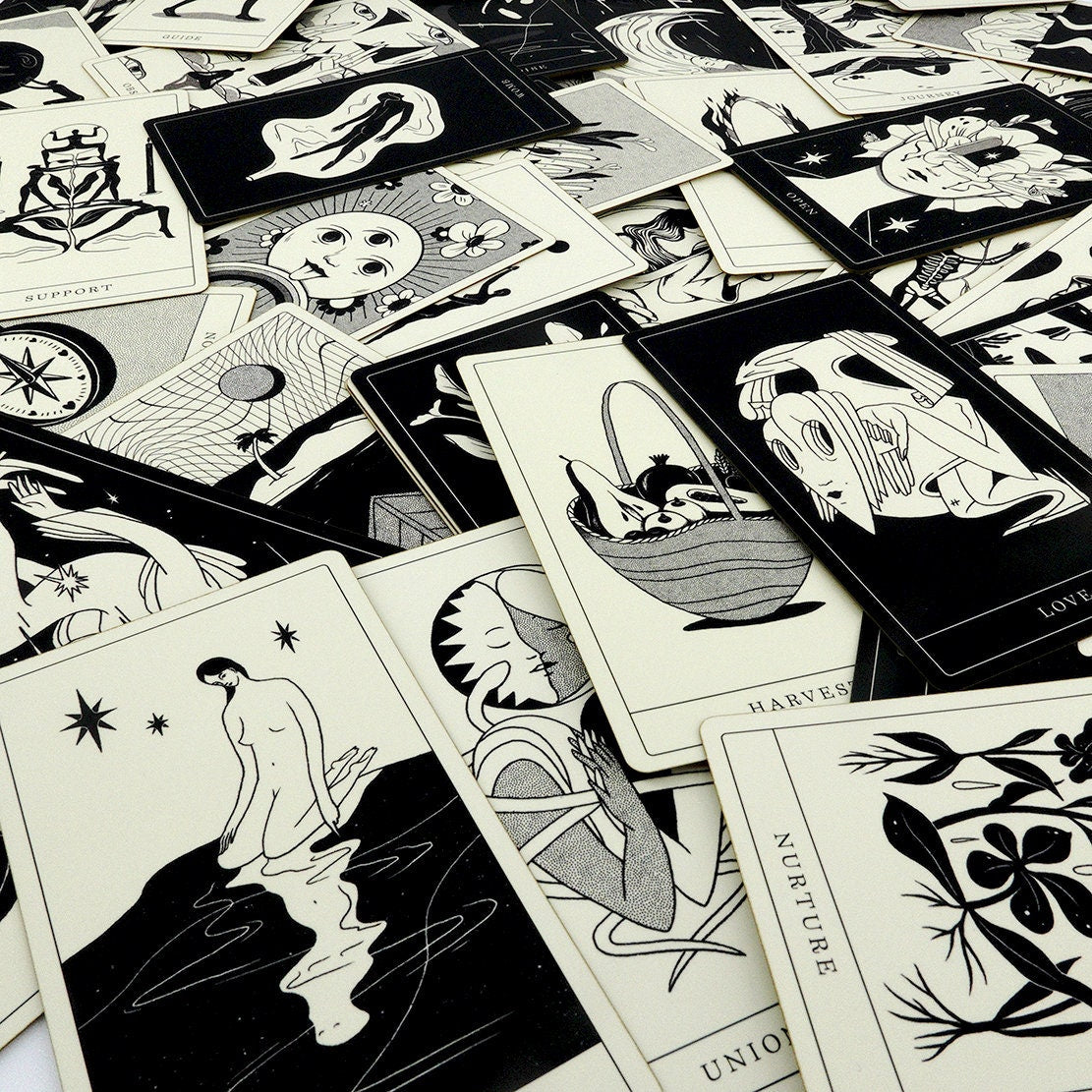 Illustrated cards from Poesis deck spread out